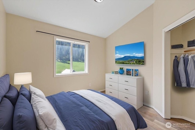 42480 N State Route 25, Davenport, WA 99122 - bedroom featuring light wood-style floors, baseboards, and vaulted ceiling