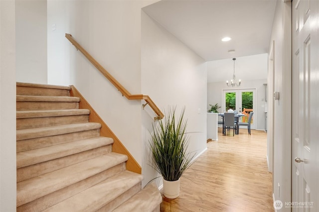 10411 23rd Street Ct E, Edgewood, WA 98372 - stairs featuring wood finished floors, recessed lighting, and a chandelier