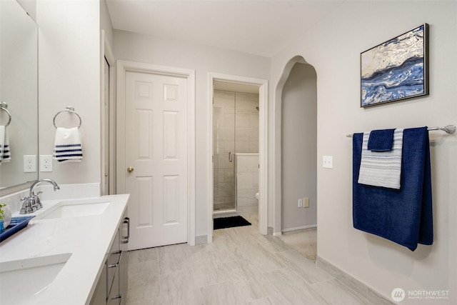 10411 23rd Street Ct E, Edgewood, WA 98372 - bathroom with double vanity, a shower stall, and marble finish floors