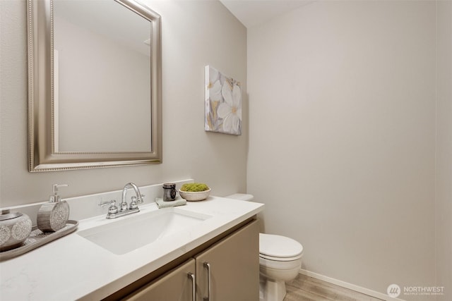 10411 23rd Street Ct E, Edgewood, WA 98372 - half bath featuring vanity and wood finished floors
