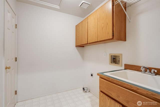 10411 23rd Street Ct E, Edgewood, WA 98372 - laundry room with cabinet space, electric dryer hookup, light flooring, and washer hookup