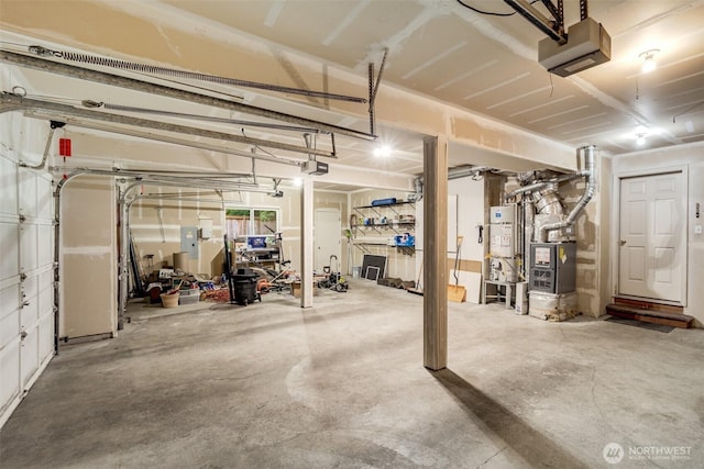 10411 23rd Street Ct E, Edgewood, WA 98372 - garage with water heater, a garage door opener, electric panel, and heating unit