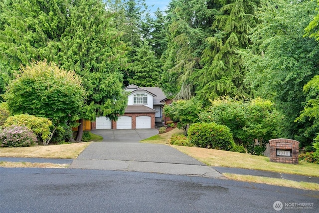 10411 23rd Street Ct E, Edgewood, WA 98372 - obstructed view of property featuring driveway and a garage