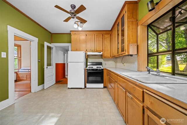 500 Wilson Ave, Bellingham, WA 98225 - kitchen with stove, freestanding refrigerator, under cabinet range hood, light countertops, and ceiling fan
