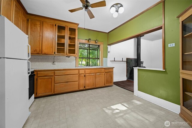500 Wilson Ave, Bellingham, WA 98225 - kitchen featuring freestanding refrigerator, ceiling fan, and brown cabinetry