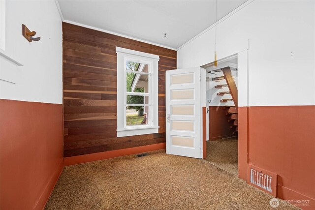 500 Wilson Ave, Bellingham, WA 98225 - empty room with wooden walls, crown molding, carpet floors, and stairs