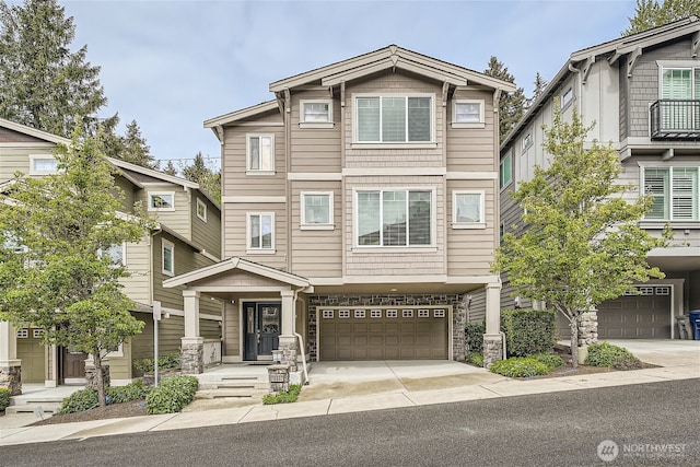 10502 SE 10th Ct Unit 9, Bellevue, WA 98004 - view of front of house with an attached garage, driveway, and stone siding