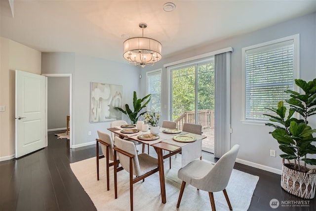 10502 SE 10th Ct Unit 9, Bellevue, WA 98004 - dining space with a chandelier, baseboards, and wood finished floors