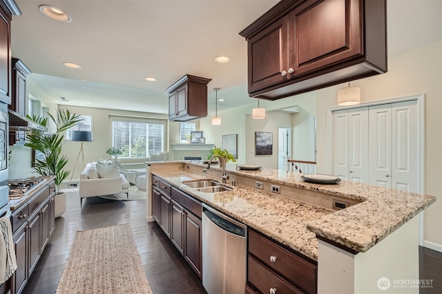 10502 SE 10th Ct Unit 9, Bellevue, WA 98004 - kitchen with stainless steel dishwasher, a sink, open floor plan, light stone counters, and dark wood finished floors
