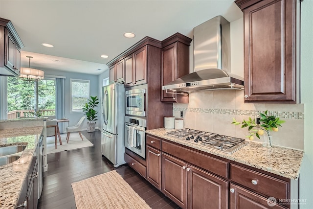 10502 SE 10th Ct Unit 9, Bellevue, WA 98004 - kitchen featuring appliances with stainless steel finishes, wall chimney range hood, backsplash, dark wood-style floors, and recessed lighting