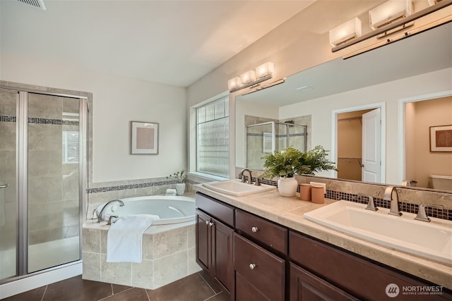 10502 SE 10th Ct Unit 9, Bellevue, WA 98004 - full bathroom with a stall shower, a bath, double vanity, tile patterned floors, and toilet