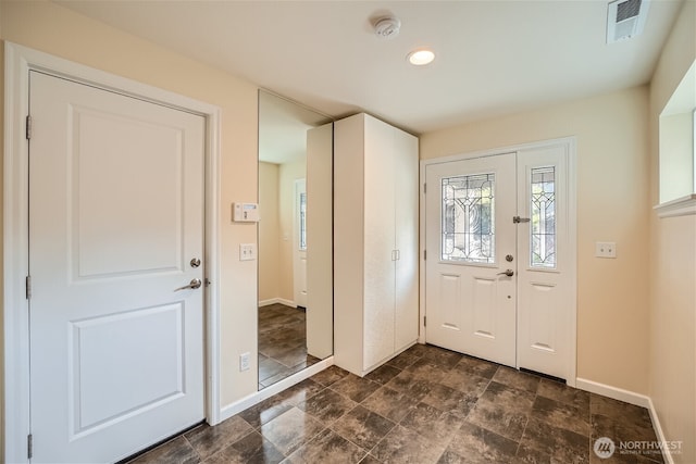 10502 SE 10th Ct Unit 9, Bellevue, WA 98004 - entrance foyer featuring baseboards, stone finish flooring, and recessed lighting