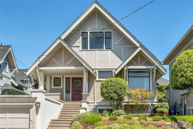 2008 Nob Hill Ave N, Seattle, WA 98119 - tudor home with covered porch, stairs, and stucco siding