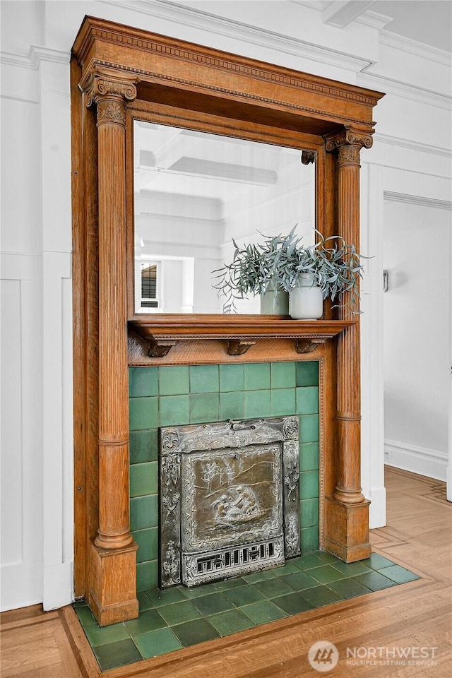 2008 Nob Hill Ave N, Seattle, WA 98119 - detailed view of a tiled fireplace and wood finished floors