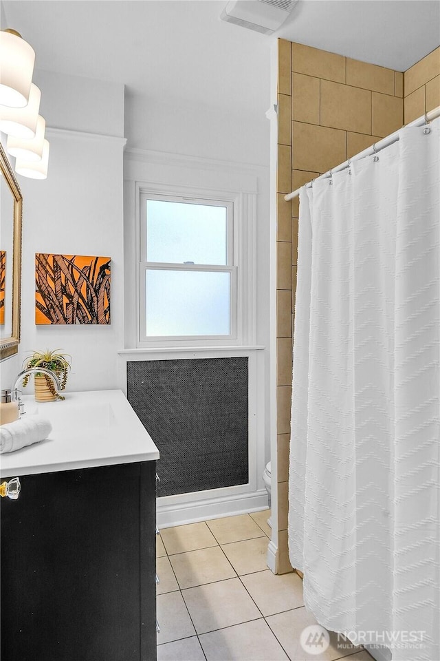 2008 Nob Hill Ave N, Seattle, WA 98119 - bathroom with vanity, toilet, tile patterned flooring, and a shower with shower curtain