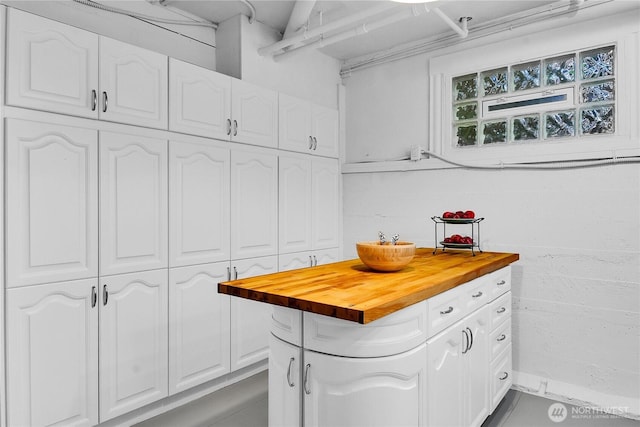 2008 Nob Hill Ave N, Seattle, WA 98119 - kitchen featuring butcher block countertops and white cabinets