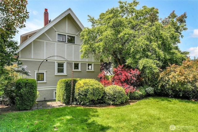 2008 Nob Hill Ave N, Seattle, WA 98119 - view of side of home with a yard and a chimney