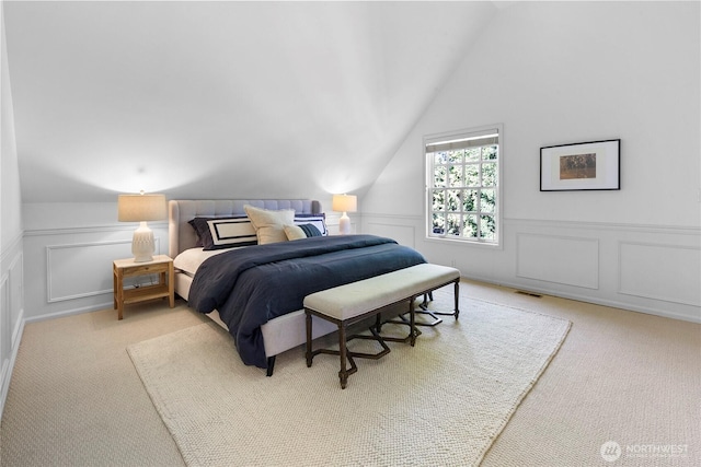 2020 Evergreen Point Rd, Medina, WA 98039 - carpeted bedroom featuring a decorative wall, vaulted ceiling, and a wainscoted wall
