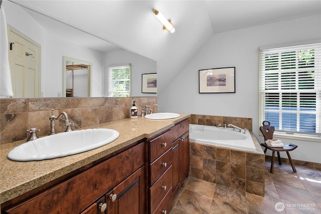 2020 Evergreen Point Rd, Medina, WA 98039 - full bath featuring a garden tub, double vanity, lofted ceiling, and decorative backsplash