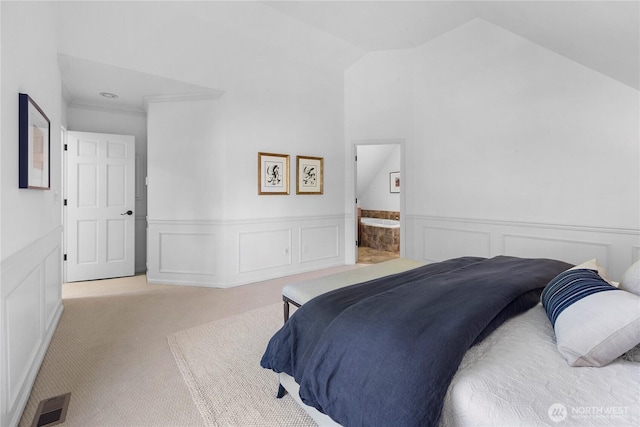 2020 Evergreen Point Rd, Medina, WA 98039 - carpeted bedroom with a wainscoted wall, a decorative wall, vaulted ceiling, ornamental molding, and ensuite bath