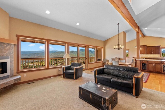 4261 April Dr, Wenatchee, WA 98801 - living area with light carpet, a chandelier, baseboards, recessed lighting, and a premium fireplace
