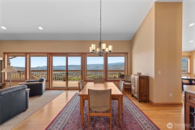 4261 April Dr, Wenatchee, WA 98801 - dining space featuring light wood-style floors, a mountain view, a chandelier, recessed lighting, and baseboards