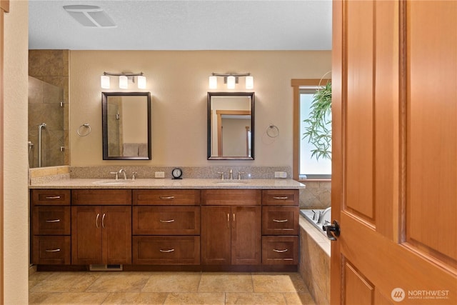 4261 April Dr, Wenatchee, WA 98801 - full bathroom with double vanity, a garden tub, and tiled shower