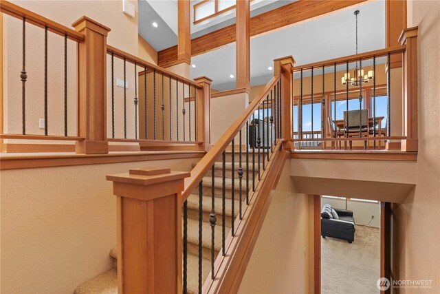 4261 April Dr, Wenatchee, WA 98801 - stairs featuring a chandelier, a high ceiling, carpet flooring, and recessed lighting