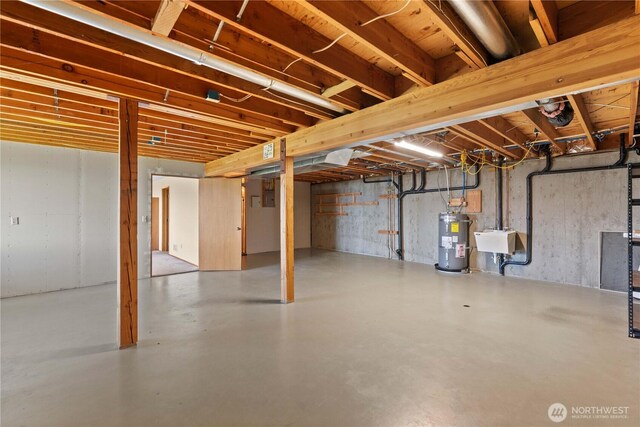4261 April Dr, Wenatchee, WA 98801 - unfinished below grade area featuring water heater and a sink