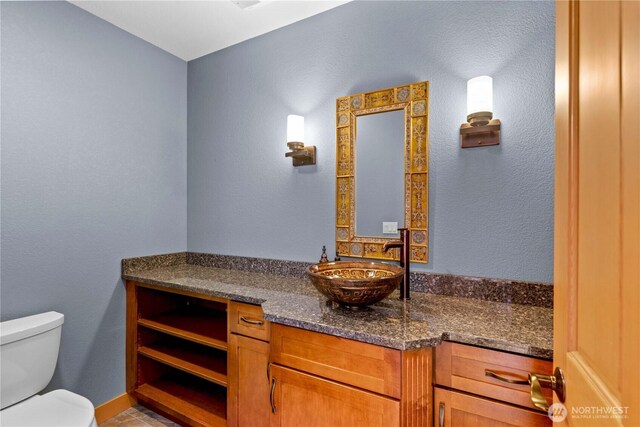 4261 April Dr, Wenatchee, WA 98801 - bathroom with toilet, vanity, and tile patterned flooring