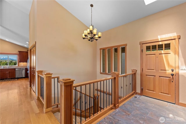 4261 April Dr, Wenatchee, WA 98801 - foyer entrance with vaulted ceiling, a chandelier, and light wood-type flooring