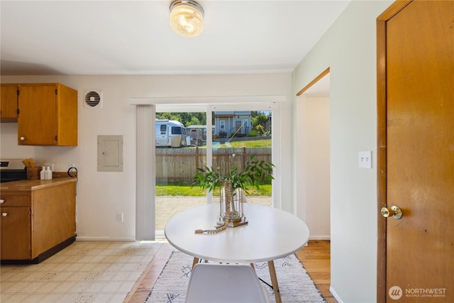 3309 W 2nd St, Anacortes, WA 98221 - dining room featuring baseboards and light wood-type flooring