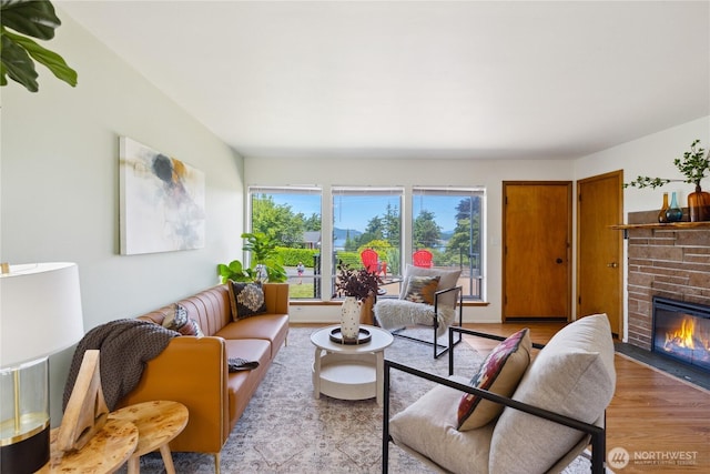 3309 W 2nd St, Anacortes, WA 98221 - living room with light wood-type flooring and a stone fireplace