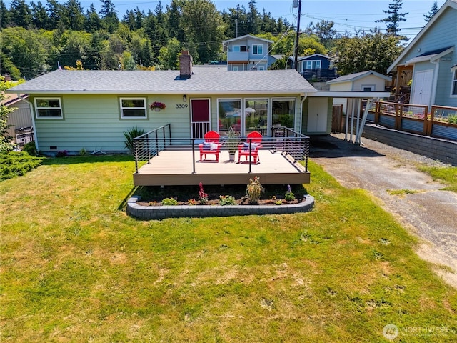 3309 W 2nd St, Anacortes, WA 98221 - rear view of property featuring driveway, a chimney, a deck, and a lawn