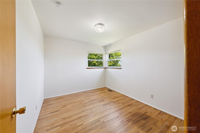 3309 W 2nd St, Anacortes, WA 98221 - empty room featuring light wood-style flooring, baseboards, and a smoke detector