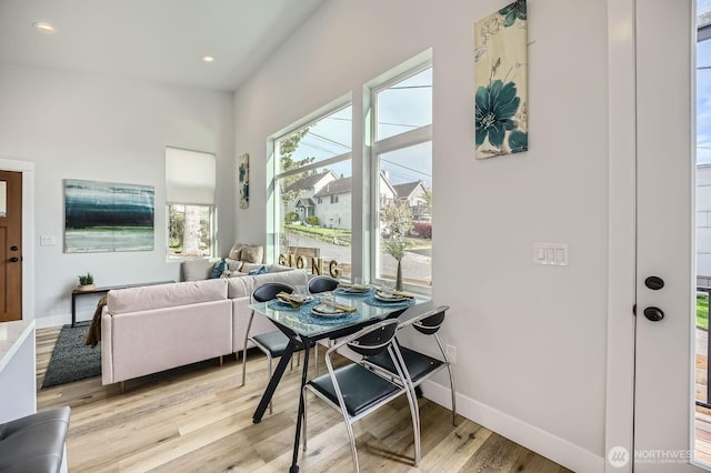 1808 S Raymond St, Seattle, WA 98108 - dining space with light wood finished floors, baseboards, and recessed lighting