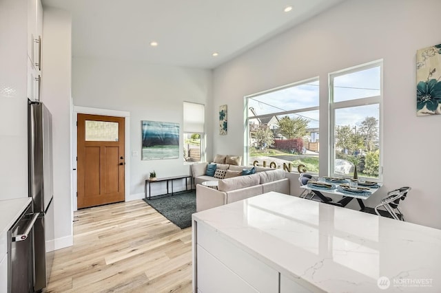 1808 S Raymond St, Seattle, WA 98108 - living room with recessed lighting, healthy amount of natural light, light wood-style flooring, and baseboards