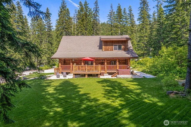 158 Big Pine Dr, Leavenworth, WA 98826 - back of property with log siding, a lawn, a view of trees, and a wooden deck