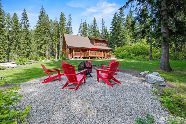 158 Big Pine Dr, Leavenworth, WA 98826 - view of patio / terrace with a wooden deck, an outdoor fire pit, and a view of trees