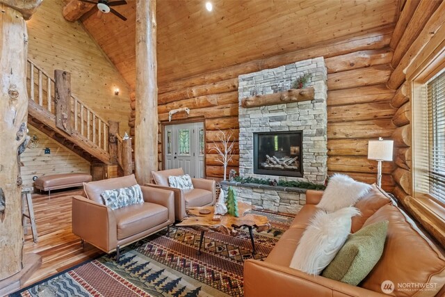 158 Big Pine Dr, Leavenworth, WA 98826 - living room featuring wood finished floors, high vaulted ceiling, ceiling fan, wood ceiling, and a stone fireplace