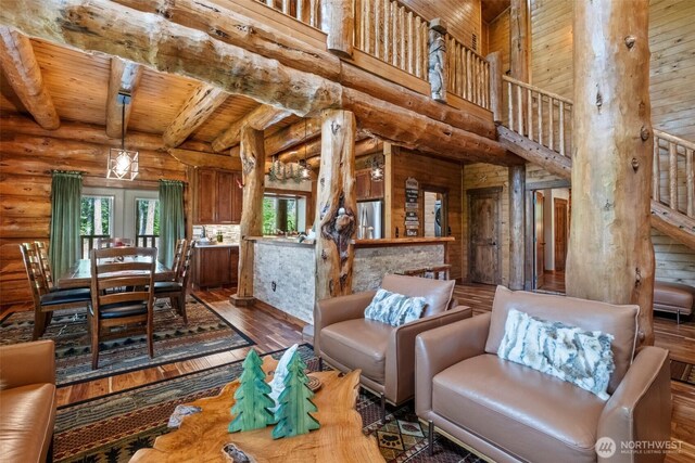 158 Big Pine Dr, Leavenworth, WA 98826 - living area featuring hardwood / wood-style floors, stairway, rustic walls, wood ceiling with exposed beams, and a towering ceiling