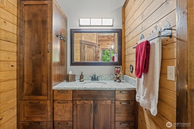 158 Big Pine Dr, Leavenworth, WA 98826 - bathroom featuring vanity and wood walls