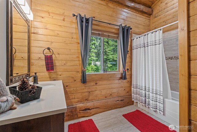 158 Big Pine Dr, Leavenworth, WA 98826 - bathroom featuring wooden walls, vanity, and shower / tub combo with curtain
