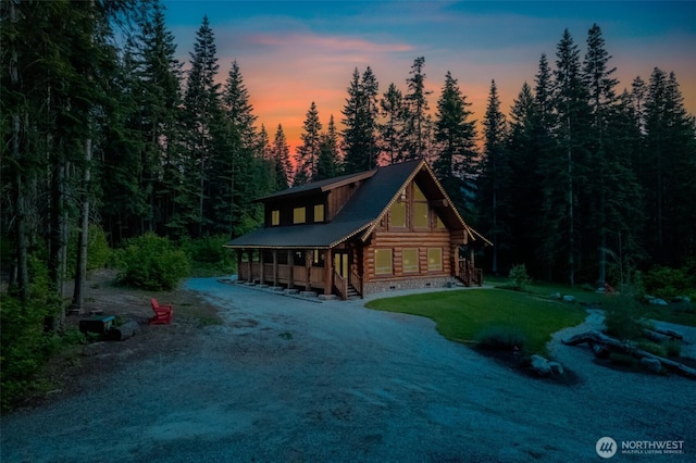 158 Big Pine Dr, Leavenworth, WA 98826 - cabin featuring log exterior, a wooded view, crawl space, and covered porch