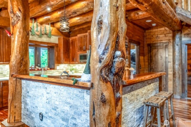 158 Big Pine Dr, Leavenworth, WA 98826 - indoor bar with white microwave, wood finished floors, tasteful backsplash, and beamed ceiling