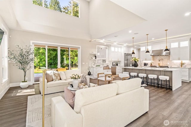 23036 35th Ave SE, Bothell, WA 98021 - living area featuring wood finished floors, plenty of natural light, baseboards, and recessed lighting