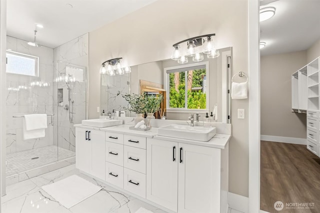 23036 35th Ave SE, Bothell, WA 98021 - full bathroom with a marble finish shower, healthy amount of natural light, double vanity, and baseboards