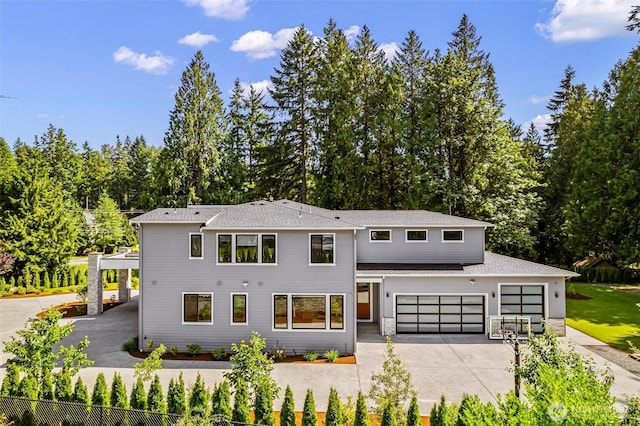 23036 35th Ave SE, Bothell, WA 98021 - view of front of house featuring concrete driveway, a shingled roof, and an attached garage