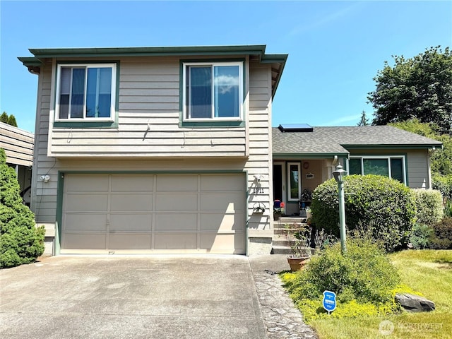 1711 Mount Rainier Blvd, Spanaway, WA 98387 - view of front of home with driveway and a garage