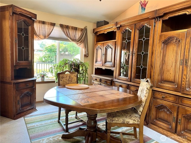 1711 Mount Rainier Blvd, Spanaway, WA 98387 - dining room featuring light colored carpet and lofted ceiling